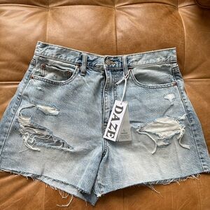 Women’s distressed faded blue jean shorts. NEW with tags. NEVER been worn.